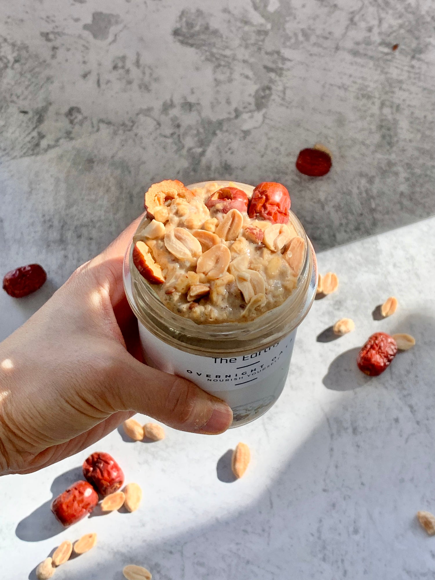 Peanut & Jujube Superfood Overnight Oats - crunchy peanuts with sweet, red jujube pieces, ready to eat in glass jar